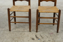 Load image into Gallery viewer, Pair of Vintage Wood Ladder Back Dining Chairs with Woven Rush Seats