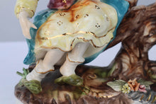 Load image into Gallery viewer, Capodimonte Porcelain Figurine – Boy and Girl Playing See-Saw on Log