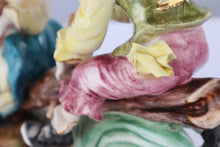 Load image into Gallery viewer, Capodimonte Porcelain Figurine – Boy and Girl Playing See-Saw on Log