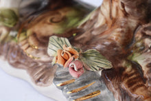 Load image into Gallery viewer, Capodimonte Porcelain Figurine – Boy and Girl Playing See-Saw on Log