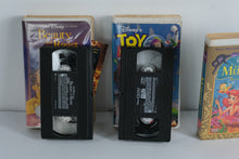 Load image into Gallery viewer, Disney VHS Trio – Beauty and the Beast, Toy Story, & The Little Mermaid (Still Sealed!) – Classic Clamshell Editions – Perfect for Display & Retro Decor