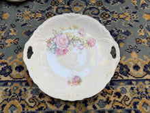 Load image into Gallery viewer, Antique Handled Porcelain Cake Plate – Pink Rose Floral Design with Embossed Scroll Edge, Early 1900s