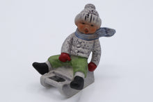 Load image into Gallery viewer, Goebel Porcelain Figurine โ Child on Sled Winter Scene #13904-07, Hand-Painted Germany