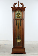 Load image into Gallery viewer, Howard Miller Traditional Cherry Grandfather Clock with Moon Phase Dial and Cable Driven Movement