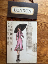 Load image into Gallery viewer, London Fashion Girl Wall Hanging Art Plaque – Illustrated City Decor, Ribbon Hanging, 21.5"