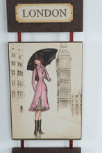 Load image into Gallery viewer, London Fashion Girl Wall Hanging Art Plaque – Illustrated City Decor, Ribbon Hanging, 21.5"