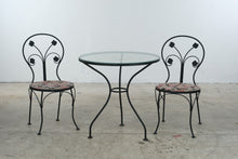 Load image into Gallery viewer, Wrought Iron Glass Top Bistro Table and Two Floral Side Chairs