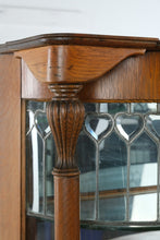 Load image into Gallery viewer, Antique Tiger Oak Curved Glass Curio Cabinet with Leaded Glass and Claw Feet
