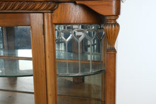 Load image into Gallery viewer, Antique Tiger Oak Curved Glass Curio Cabinet with Leaded Glass and Claw Feet
