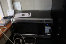 Load image into Gallery viewer, Oster 0.9 Cu. Ft. Countertop Microwave – Model OGHS9001, Stainless Steel Finish