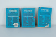 Load image into Gallery viewer, Hardy Boys Mystery Stories Lot (3 Hardcovers, 1970s Editions) – The Clue of the Broken Blade, The Bombay Boomerang, The Sign of the Crooked Arrow