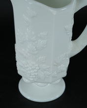 Load image into Gallery viewer, Milk Glass Footed Pitcher – Embossed Grape & Leaf Pattern, 8.5" Tall