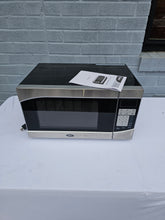 Load image into Gallery viewer, Oster 0.9 Cu. Ft. Countertop Microwave – Model OGHS9001, Stainless Steel Finish