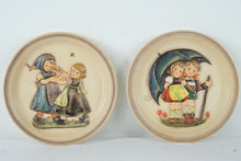 Load image into Gallery viewer, Lot of 2 Goebel M.J. Hummel Annual Collector Plates Stormy Weather 1975 &amp; Spring Dance 1980
