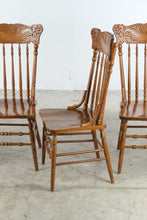 Load image into Gallery viewer, Set of Four Vintage Carved Oak Pressed Back Spindle Dining Chairs
