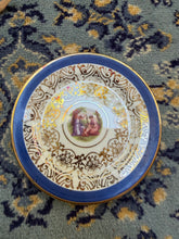 Load image into Gallery viewer, Antique O.P.Co. Syracuse China Decorative Plate – “Classical Scene” Gold Filigree &amp; Cobalt Rim
