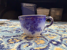 Load image into Gallery viewer, Antique Flow Blue Teacup with Gold Trim – Victorian-Style Floral Pattern
