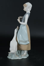 Load image into Gallery viewer, Lladró Porcelain Figurine – Girl Feeding Goose, Handcrafted in Spain
