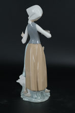 Load image into Gallery viewer, Lladró Porcelain Figurine – Girl Feeding Goose, Handcrafted in Spain
