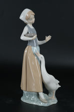 Load image into Gallery viewer, Lladró Porcelain Figurine – Girl Feeding Goose, Handcrafted in Spain
