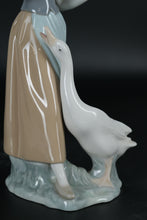 Load image into Gallery viewer, Lladró Porcelain Figurine – Girl Feeding Goose, Handcrafted in Spain
