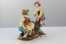 Load image into Gallery viewer, Capodimonte Boy and Girl Playing See Saw on Log
