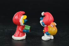 Load image into Gallery viewer, Vintage Christmas Smurfs – 1984 &amp; 1987 Schleich Peyo Figures – Santa &amp; Smurfette with Present
