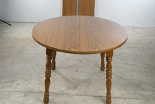Load image into Gallery viewer, Cochrane Furniture Round Oak Extendable Dining Table with 2 Leaves
