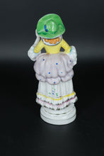 Load image into Gallery viewer, Vintage Colonial Lady Porcelain Figurine – 8.25” Hand-Painted Figurine with Bonnet and Ruffled Gown
