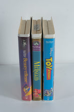 Load image into Gallery viewer, Disney VHS Trio – Beauty and the Beast, Toy Story, &amp; The Little Mermaid (Still Sealed!) – Classic Clamshell Editions – Perfect for Display &amp; Retro Decor
