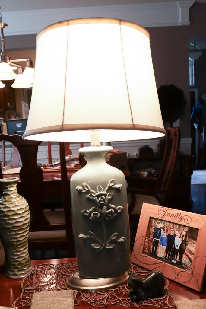Elegant Ceramic Table Lamp with Raised Floral Motif and Classic Linen Shade