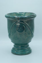 Load image into Gallery viewer, Glazed Turquoise Ceramic Vase / Planter with Raised Medallion – 10.5&quot; Tall
