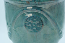 Load image into Gallery viewer, Glazed Turquoise Ceramic Vase / Planter with Raised Medallion – 10.5&quot; Tall
