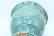 Load image into Gallery viewer, Glazed Turquoise Ceramic Vase / Planter with Raised Medallion – 10.5&quot; Tall
