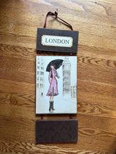 Load image into Gallery viewer, London Fashion Girl Wall Hanging Art Plaque – Illustrated City Decor, Ribbon Hanging, 21.5"
