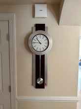 Load image into Gallery viewer, Howard Miller Bergen Wall Clock Modern Pendulum 35 Inch Metal Wood
