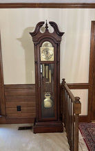 Load image into Gallery viewer, Howard Miller 61st Anniversary Grandfather Clock – Traditional Cherry Wood Longcase Clock
