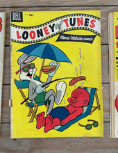 Load image into Gallery viewer, Lot of 4 Vintage Dell Looney Tunes Comics — Porky Pig, Daffy Duck &amp; Looney Tunes (1950s–1960s) | Classic Warner Bros. Characters
