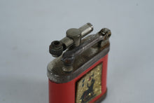 Load image into Gallery viewer, Girey Lift Arm Petrol Lighter, Red Enamel with Seated Figure &amp; Lamp Motif
