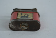 Load image into Gallery viewer, Girey Lift Arm Petrol Lighter, Red Enamel with Seated Figure &amp; Lamp Motif

