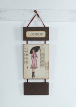 Load image into Gallery viewer, London Fashion Girl Wall Hanging Art Plaque – Illustrated City Decor, Ribbon Hanging, 21.5"
