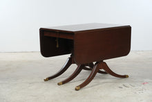 Load image into Gallery viewer, Vintage Mahogany Drop Leaf Dining Table with Triple Pedestal Brass Capped Base
