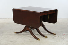 Load image into Gallery viewer, Vintage Mahogany Drop Leaf Dining Table with Triple Pedestal Brass Capped Base
