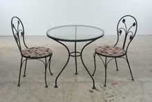Load image into Gallery viewer, Wrought Iron Glass Top Bistro Table and Two Floral Side Chairs
