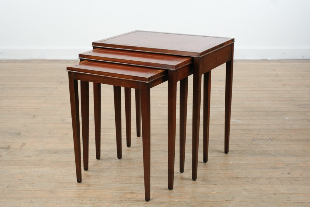 “The Wexford Trio” – Vintage Leather-Top Nesting Tables with Gold Tooling