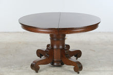 Load image into Gallery viewer, Antique Victorian Oak Round Pedestal Dining Table on Casters

