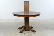 Load image into Gallery viewer, Traditional Oak Round Pedestal Dining Table with Claw Feet and 12-Inch Extension Leaf
