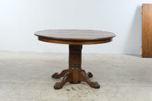 Load image into Gallery viewer, Traditional Oak Round Pedestal Dining Table with Claw Feet and 12-Inch Extension Leaf
