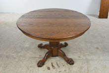 Load image into Gallery viewer, Traditional Oak Round Pedestal Dining Table with Claw Feet and 12-Inch Extension Leaf
