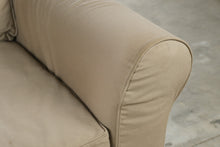 Load image into Gallery viewer, Oversized Beige Slipcovered Armchair with Rolled Arms
